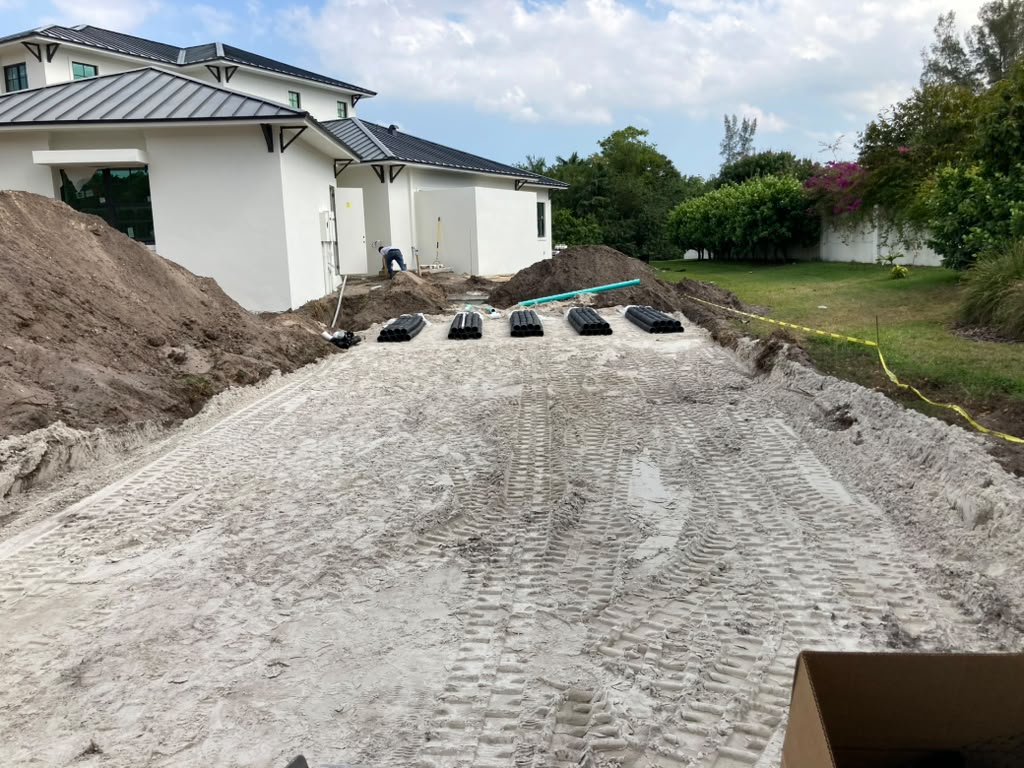 Real CTC SEPTIC new-construction installation site beside a modern white home
